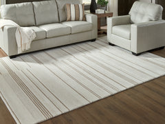 J&M Furniture - Ashley Furniture - Gadence 7'8" x 10' Area Rug - 7'8" x 10' Area Rug / Ivory/Tan - R407641