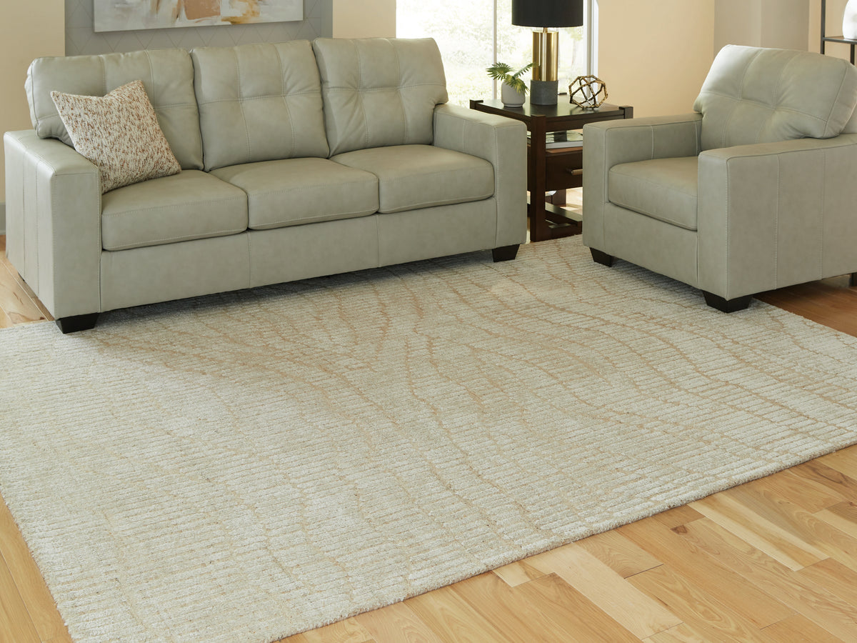 J&M Furniture - Ashley Furniture - Jaseena 7'8" x 10' Area Rug - 7'8" x 10' Area Rug / Beige/Tan - R407721