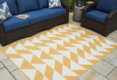 J&M Furniture - Ashley Furniture - Thomley 5' x 7' Rug - 5' x 7' Rug / Ivory/Yellow - R900062