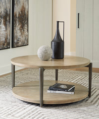 J&M Furniture - Ashley Furniture - Dyonton Coffee Table - Round Cocktail Table / Light Grayish Brown - T574-8
