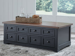 J&M Furniture - Ashley Furniture - Wildenauer Lift-Top Coffee Table - Lift Top Cocktail Table / Brown/Black - T664-9