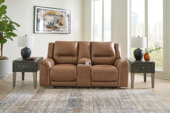 J&M Furniture - Ashley Furniture - Trasimeno Power Reclining Loveseat with Console - PWR REC Loveseat/CON/ADJ HDRST / Caramel - U8281518